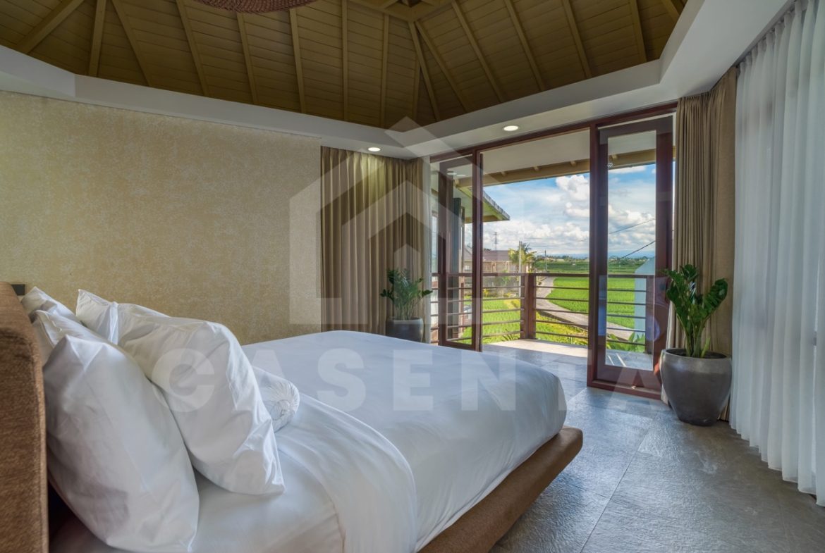 bedroom with balcony and ricefield view in Ubud villa