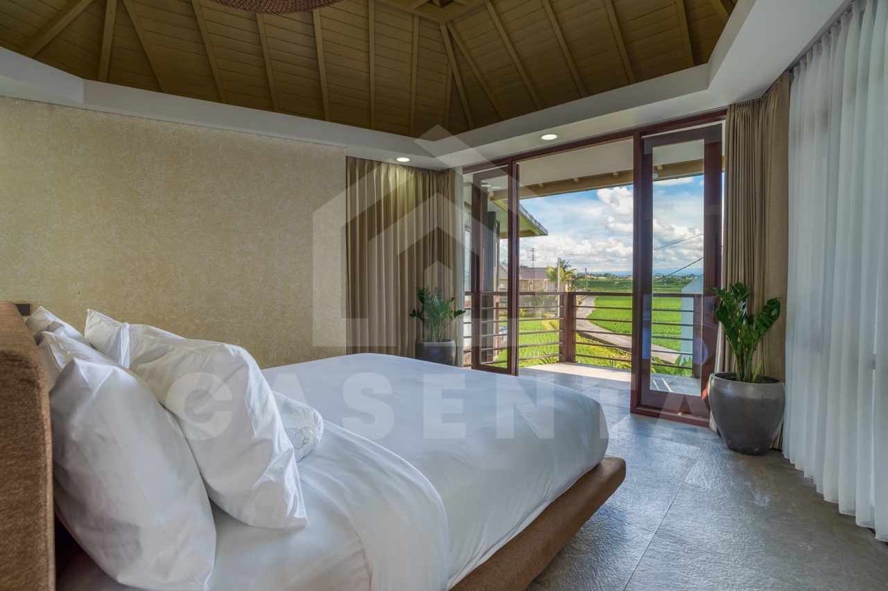 bedroom with balcony and ricefield view in Ubud villa
