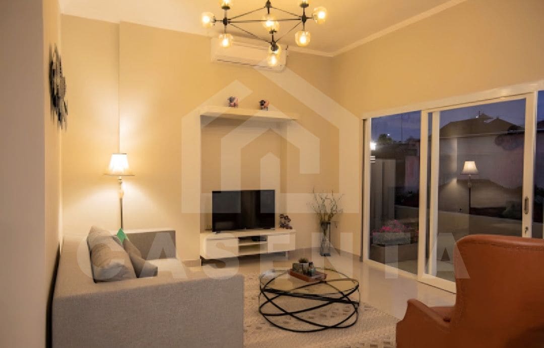 enclosed living room in Ungasan villa with modern furniture and glass doors