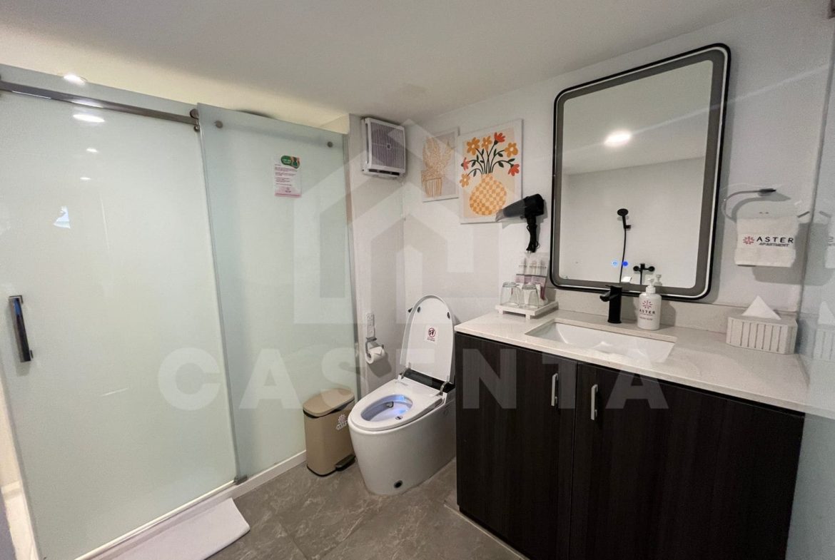 Modern bathroom with walk-in shower in Canggu apartment