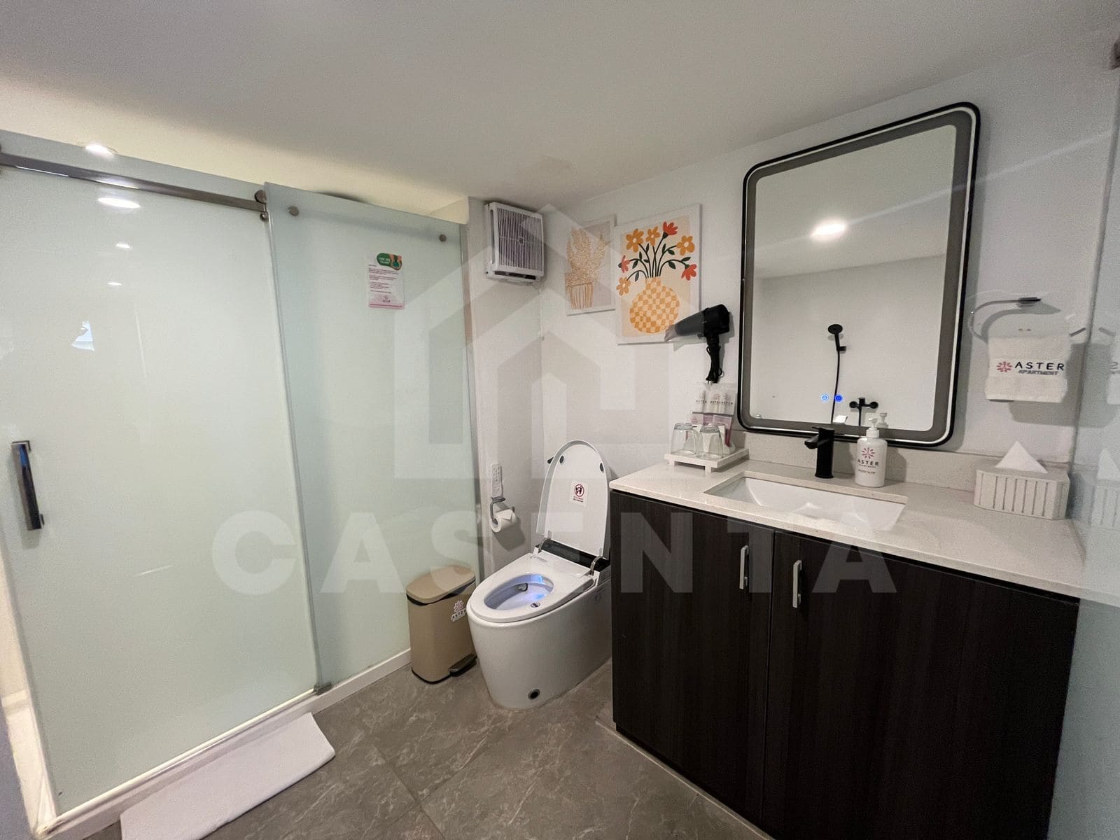 Modern bathroom with walk-in shower in Canggu apartment