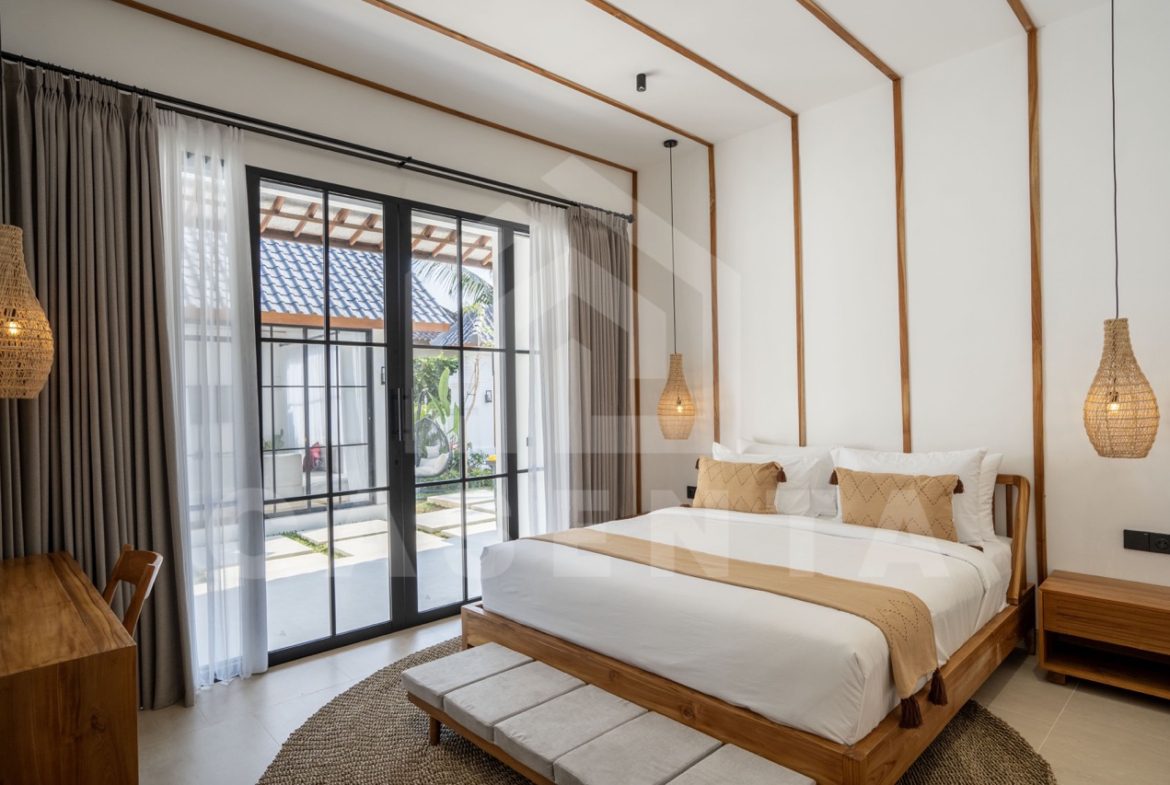 Bright bedroom in Sayan villa with garden access and natural light