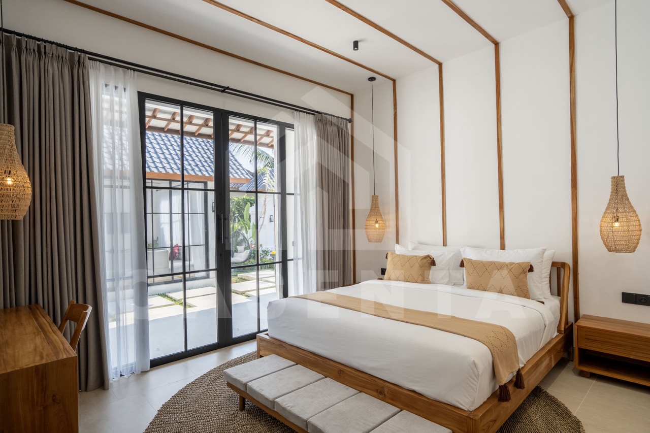 Bright bedroom in Sayan villa with garden access and natural light