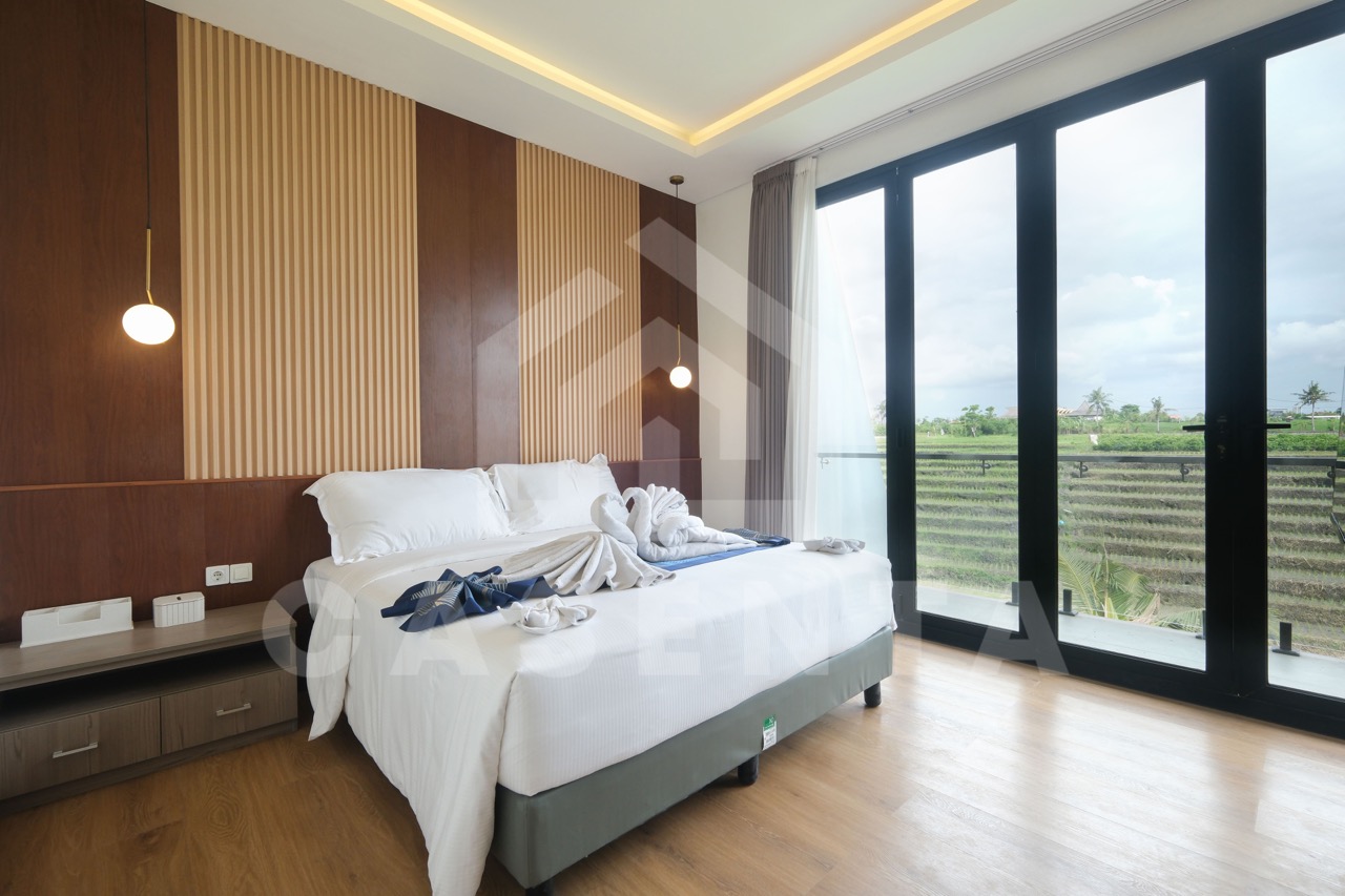Bedroom in Pererenan villa with ricefield view balcony