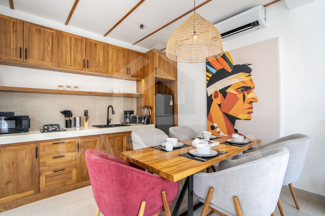 Fully equipped kitchen and dining area in Sayan villa