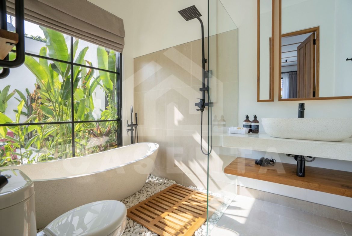Bathroom with bathtub and garden view in Sayan villa