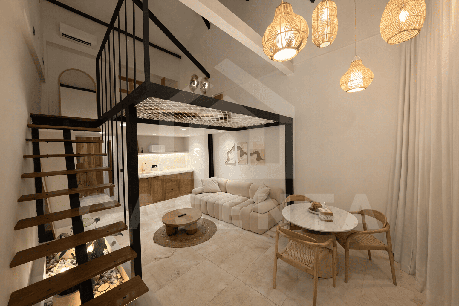Double-height living room in Sanur apartment with floating staircase