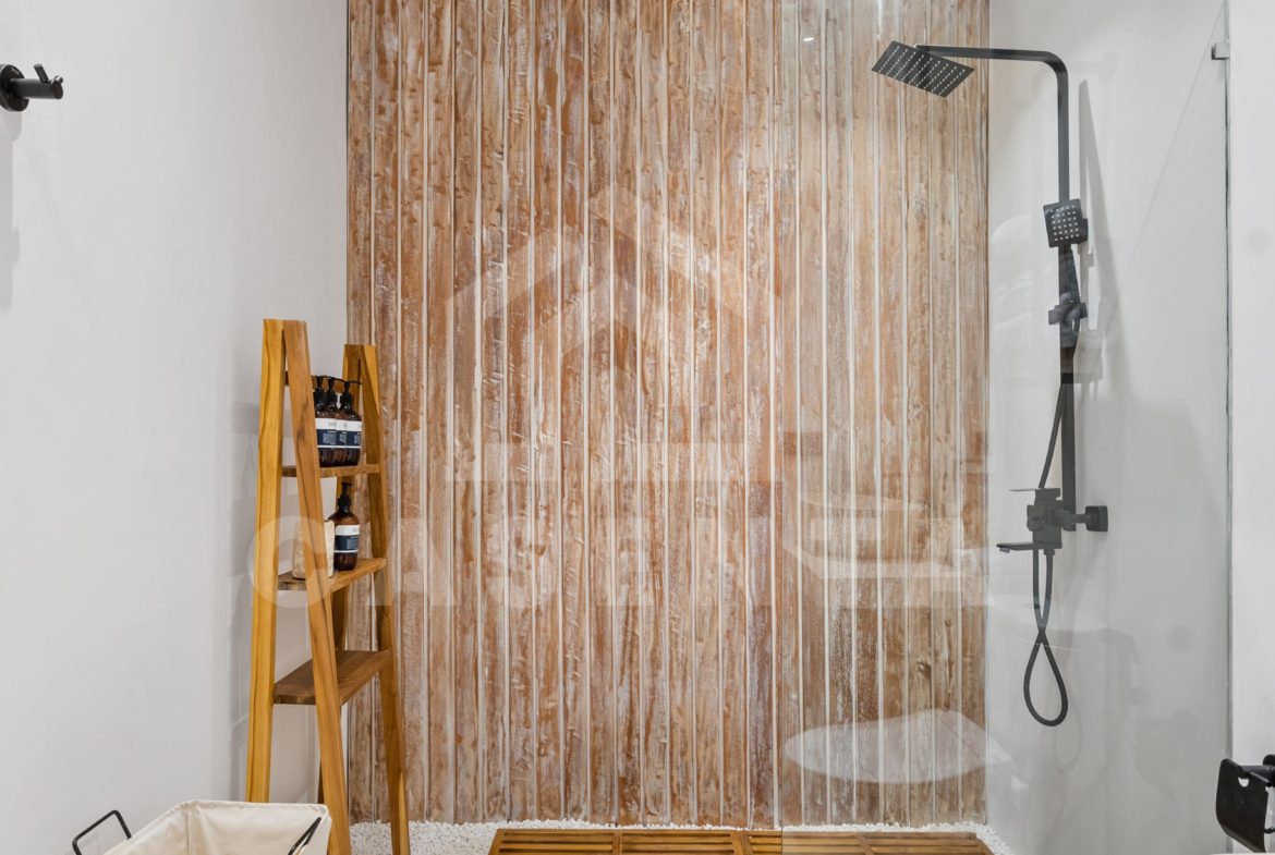 modern tropical bathroom with walk-in shower in Sayan villa
