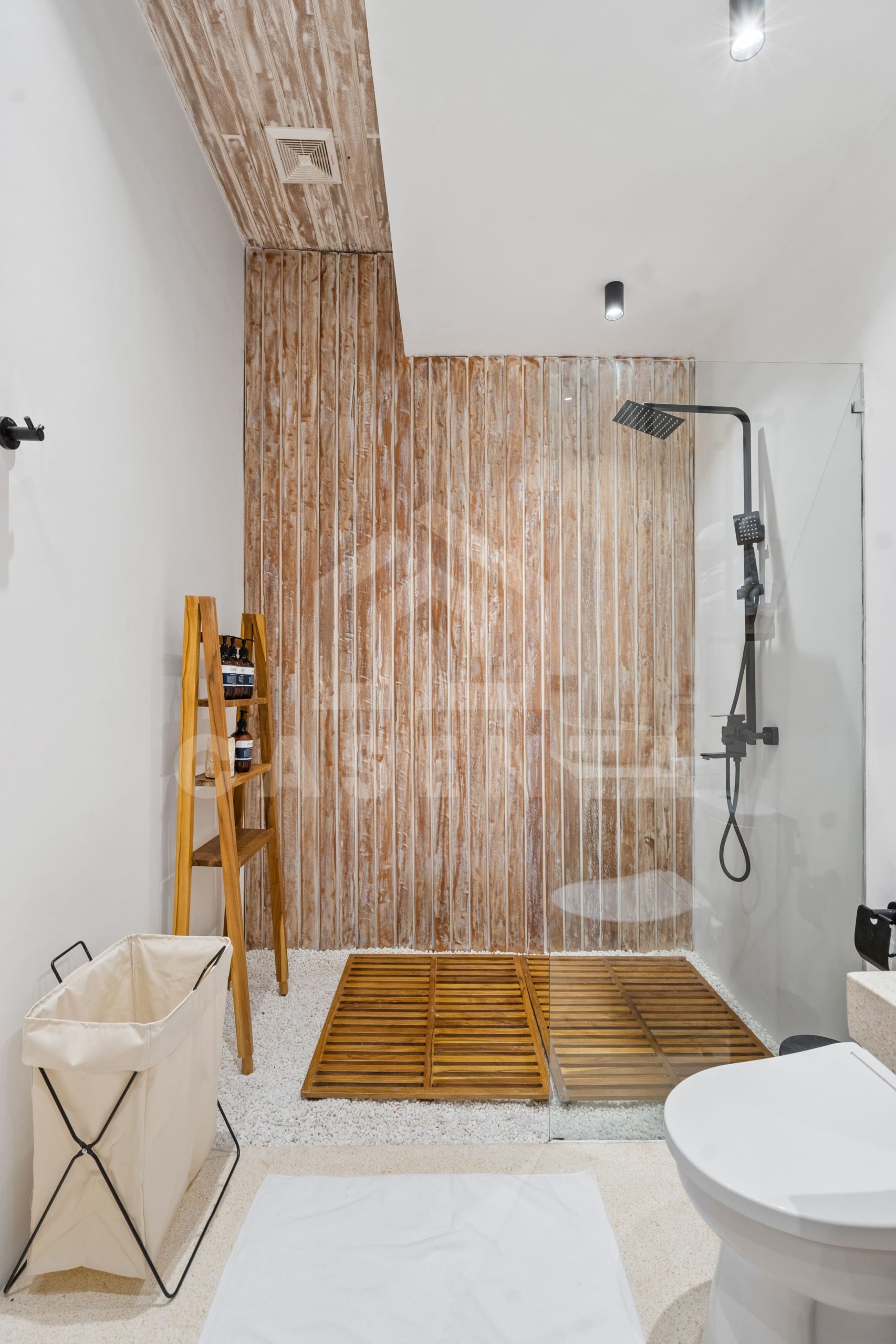 modern tropical bathroom with walk-in shower in Sayan villa