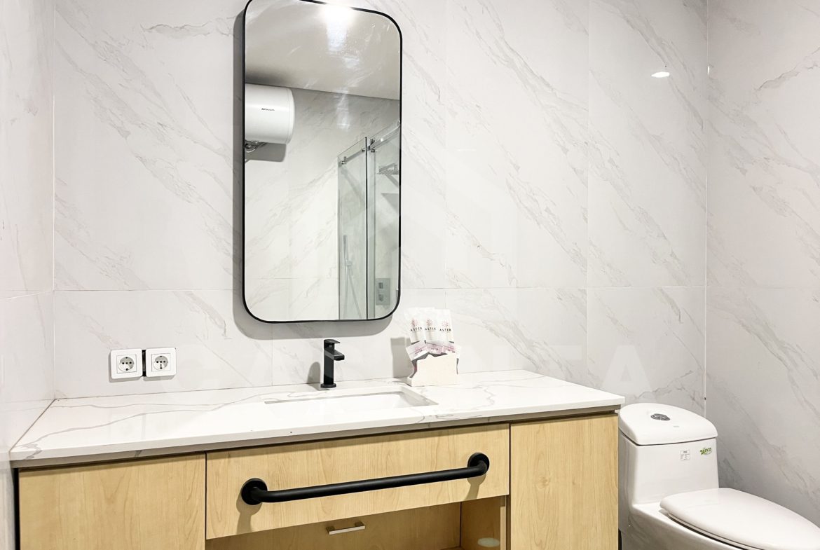 modern bathroom in Pererenan villa with marble walls and vanity