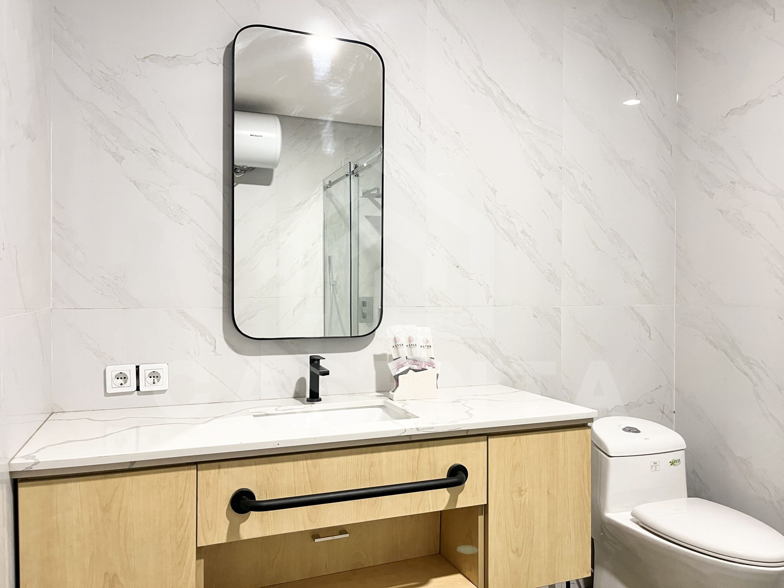 modern bathroom in Pererenan villa with marble walls and vanity