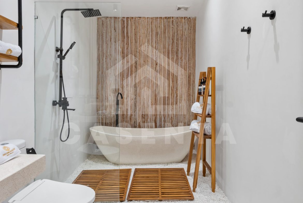 Sayan villa bathroom with freestanding bathtub and tropical design