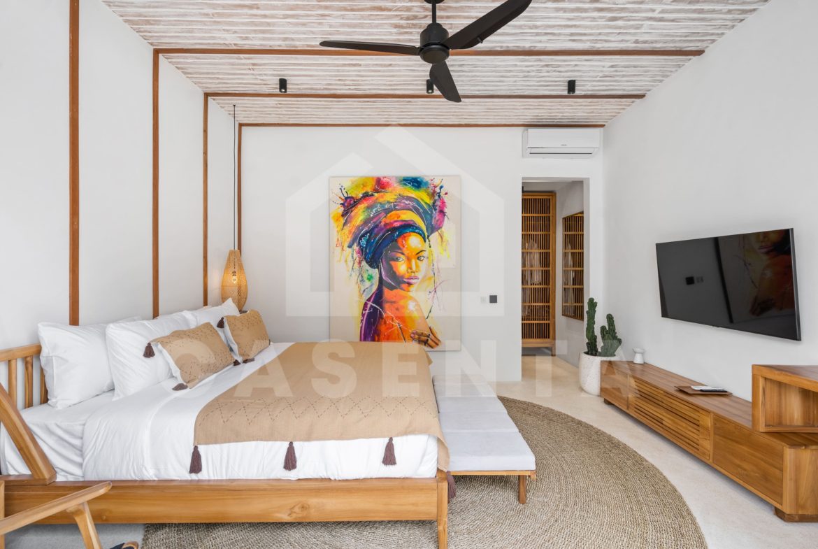 bright bedroom with wooden furniture in Sayan villa