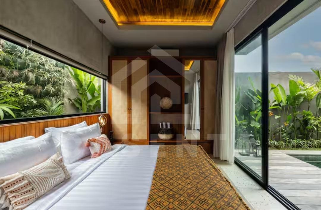 ensuite bedroom in Bukit villa with modern tropical interior