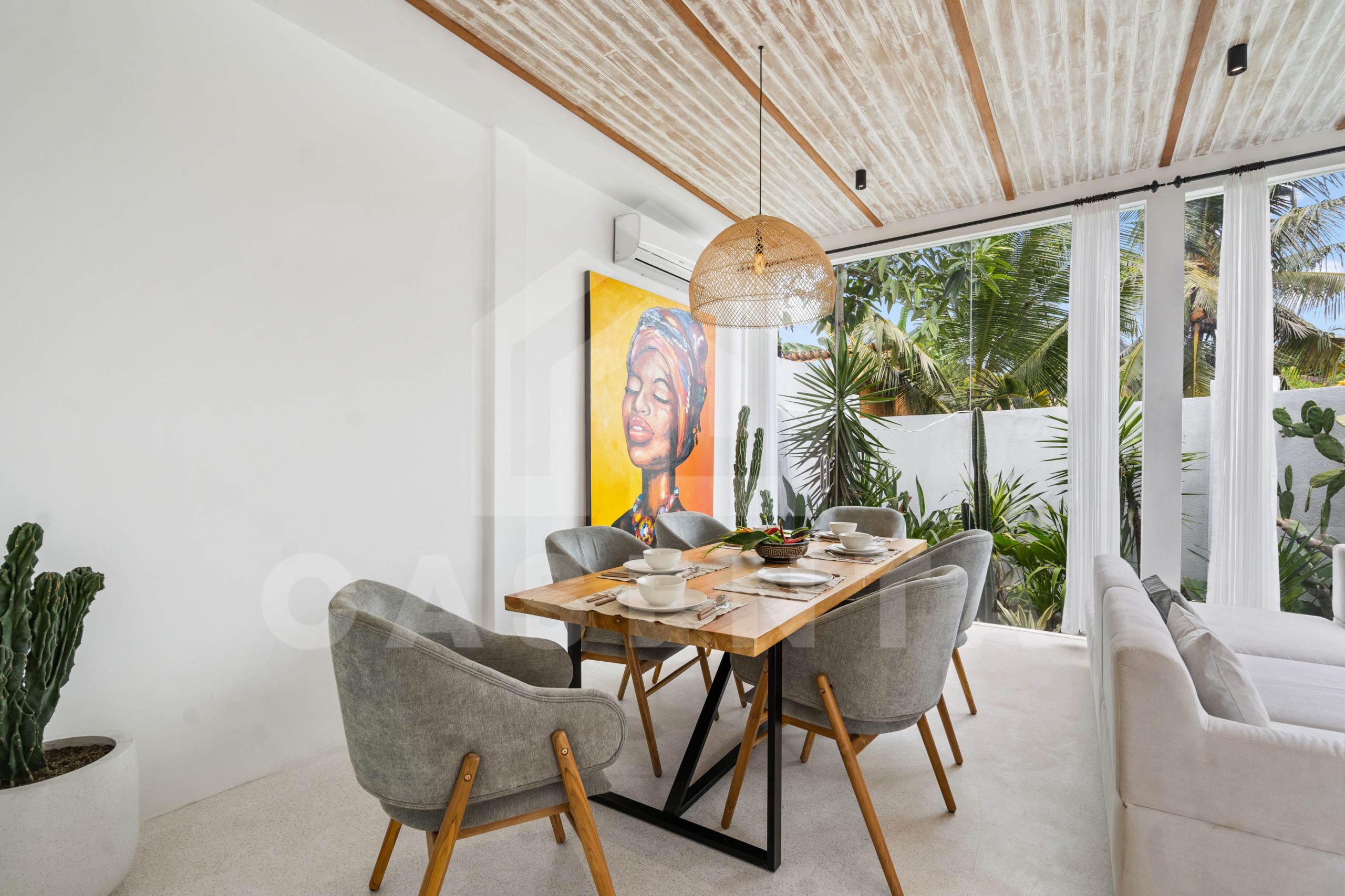 modern dining area with natural light in Sayan villa