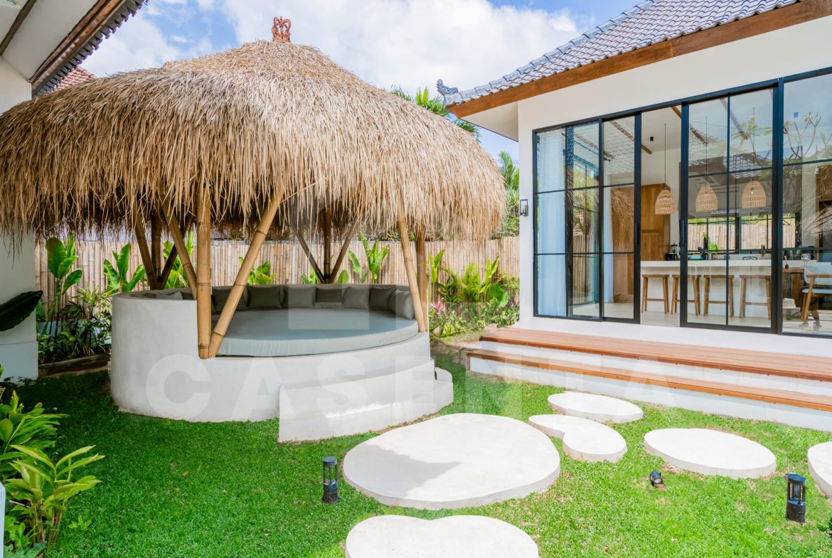 Outdoor gazebo lounge surrounded by garden in Ubud villa