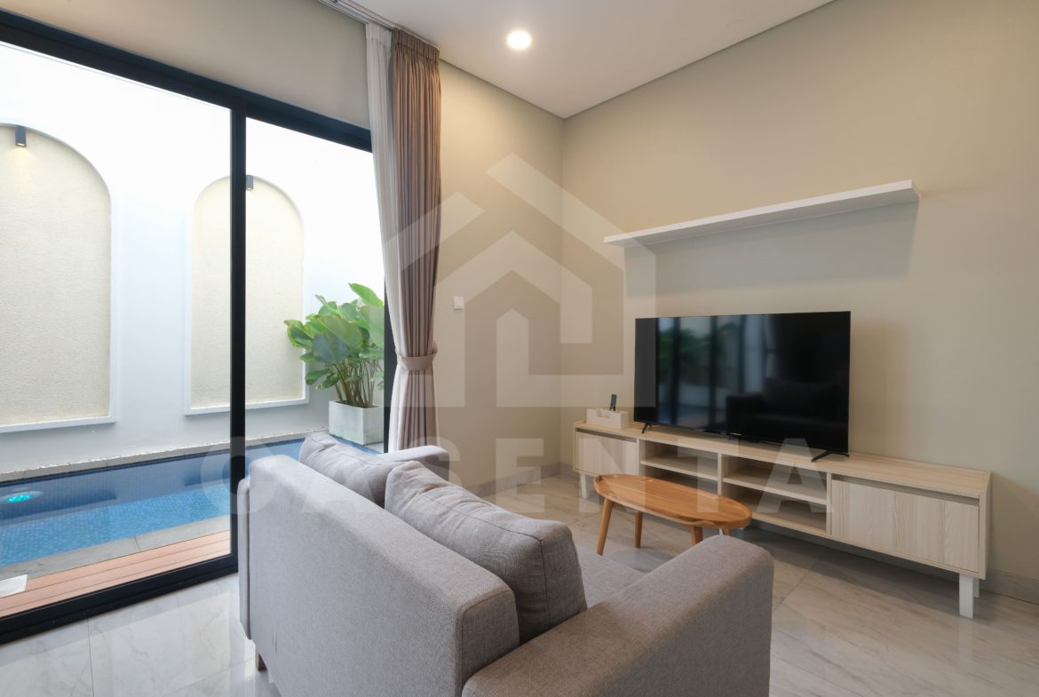 enclosed living room in Pererenan villa facing private pool