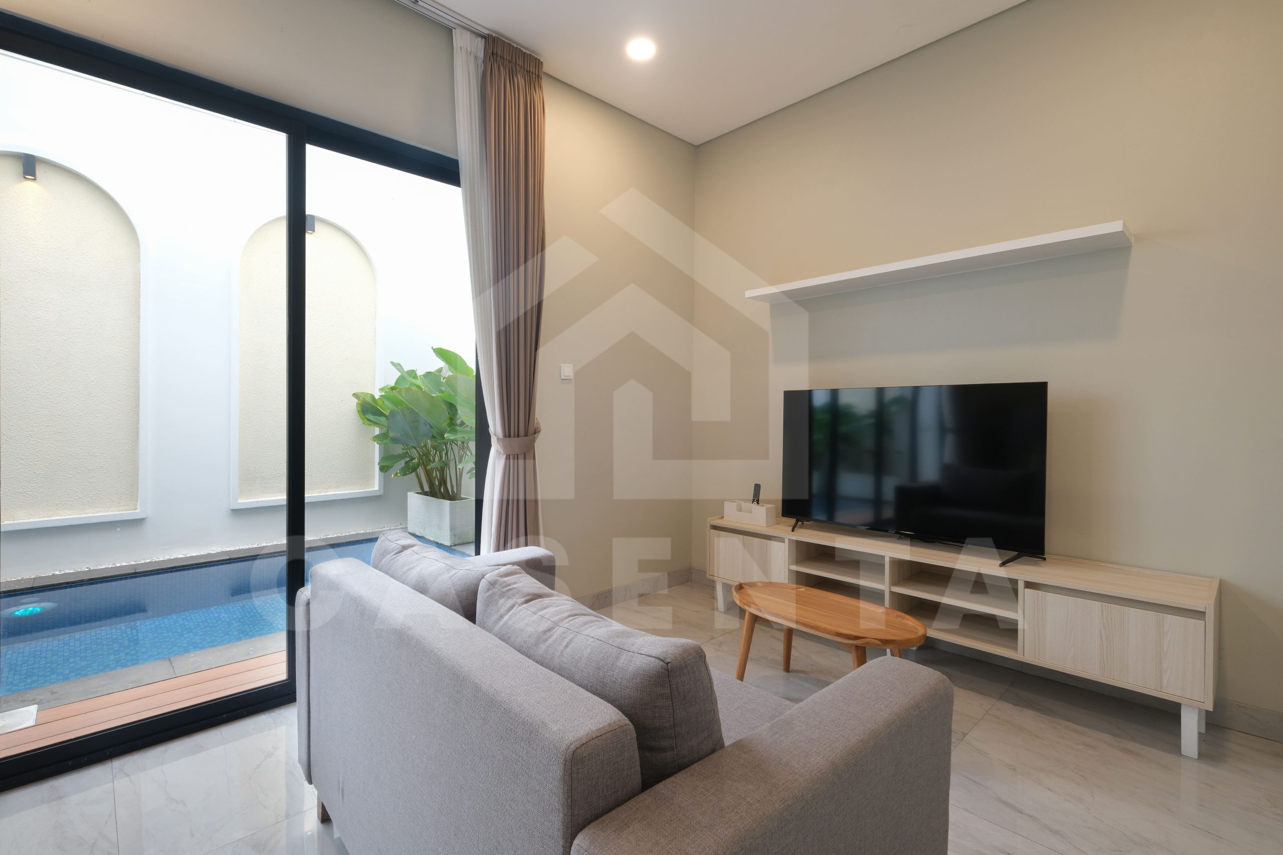 enclosed living room in Pererenan villa facing private pool