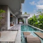 private pool area in Bukit villa with sun loungers
